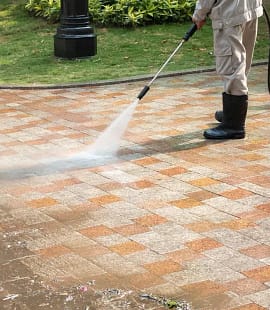 pavement being pressure washed